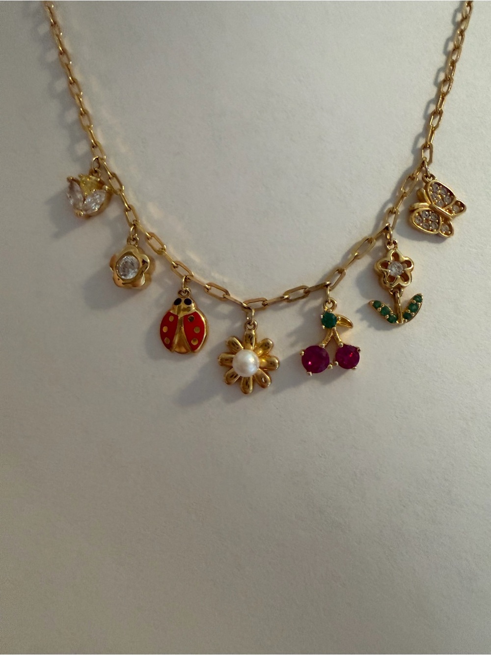 Gold Tone Floral & Charm Necklace with Red Ladybug and Pearl Flower